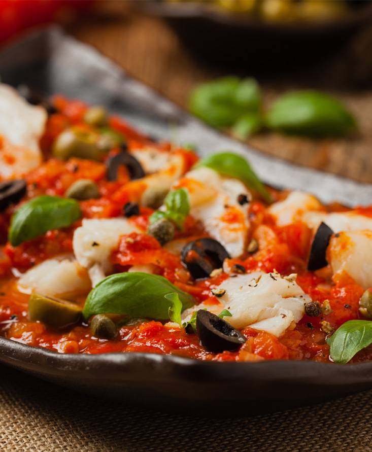 Filetti di Merluzzo al Pomodoro con Olive e Capperi