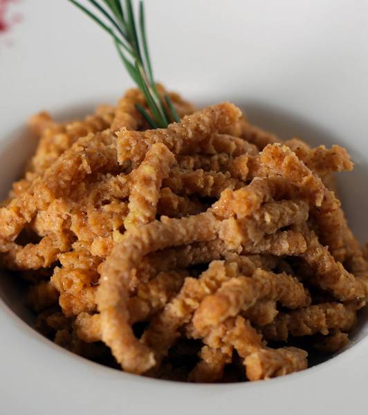 Spelt Tomato-flavoured Passatelli sautéed in clarified butter and basil