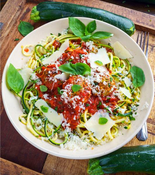 Zucchini turkey meatballs in a marinara sauce on spaghetti