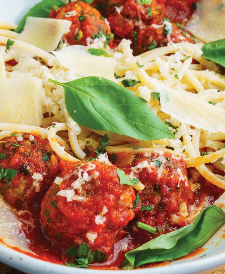 Zucchini turkey meatballs in a marinara sauce on spaghetti